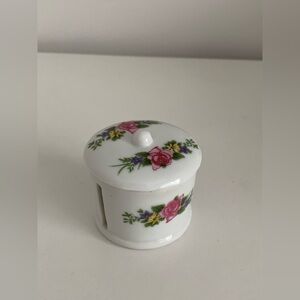 Porcelain stamp roll holder